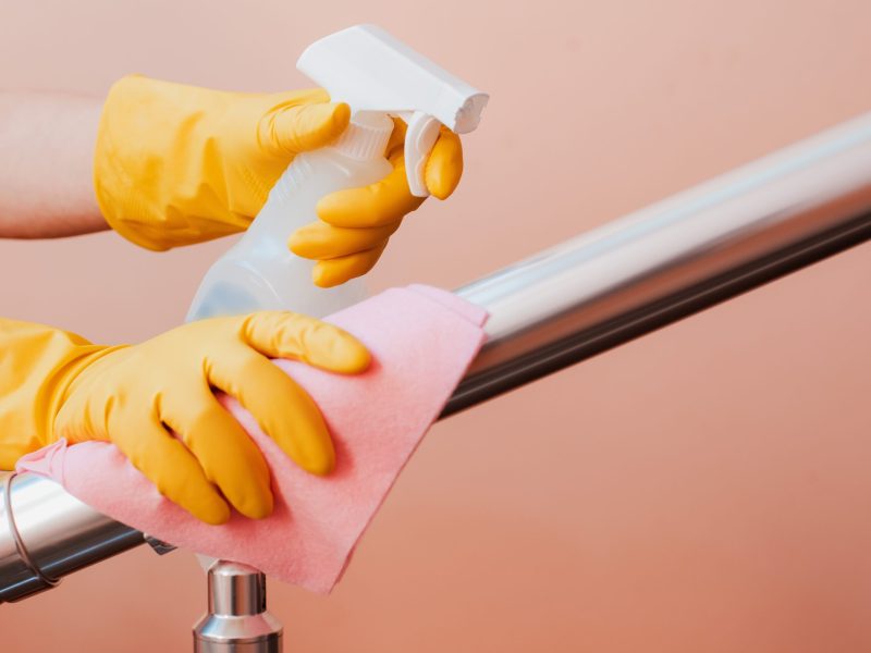 Close-up,Of,A,Woman,Cleaning,The,Stair,Railing.,Spring,Cleaning,