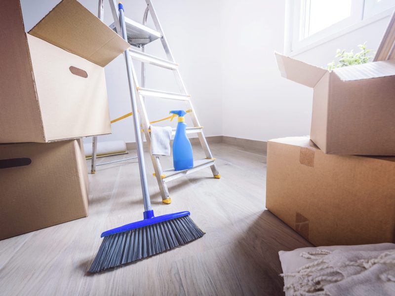 Empty,Room,Full,Of,Cardboard,Boxes,And,Cleaning,Things,For